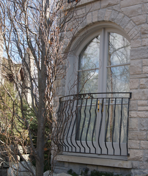 Juliet balcony, custom wrought iron metal handrail unique design mathing entry handrail and window grills from luxury Toronto area home