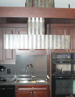 custom brass range hood variegated distressed finish fluted toronto image