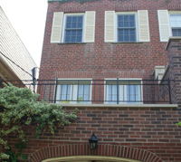 refinished metal balcony railing over toronto area garage